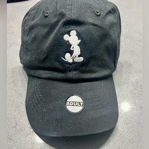 Adult all black with whiteout Mickey. Rare find.